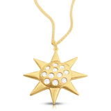 Close-up of the Guiding Sun pendant with white diamonds set in 14K gold