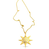 
Draped view of the 14K gold sun pendant necklace with delicate gold chain