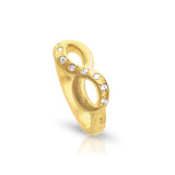 Upright view of the 14K gold infinity ring showing diamond details and band craftsmanship
