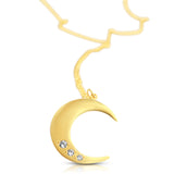 Angled view of the 14K gold Lighting Moon Necklace showing diamonds in crescent moon pendant