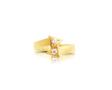 Angled side view of the 14K Gold Double Arrow Aura Ring, emphasizing the raised arrow shapes and diamond settings.