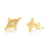 Side angle of handcrafted diamond shape earrings in gold